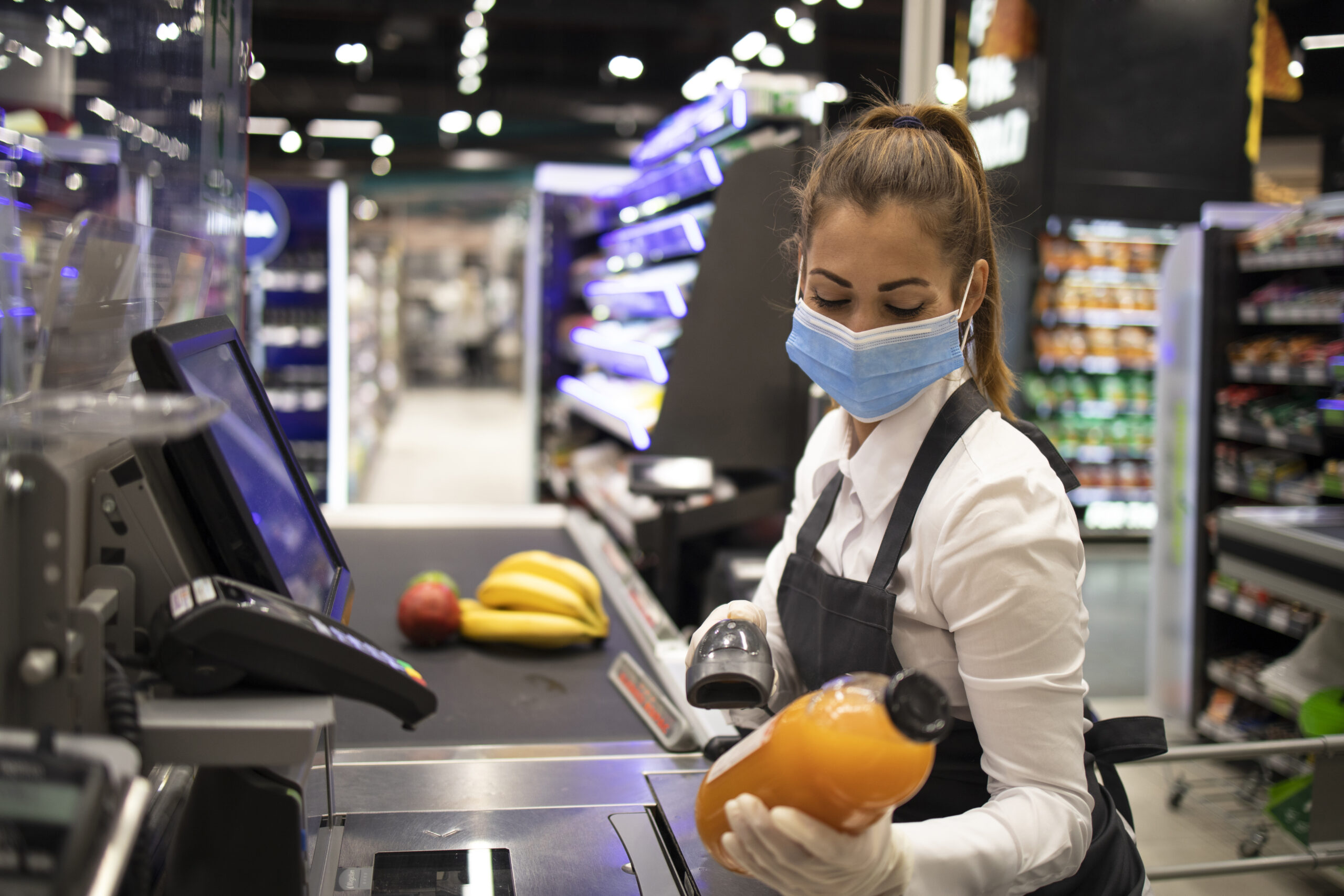 cashier supermarket wearing mask gloves fully protected against corona virus scaled