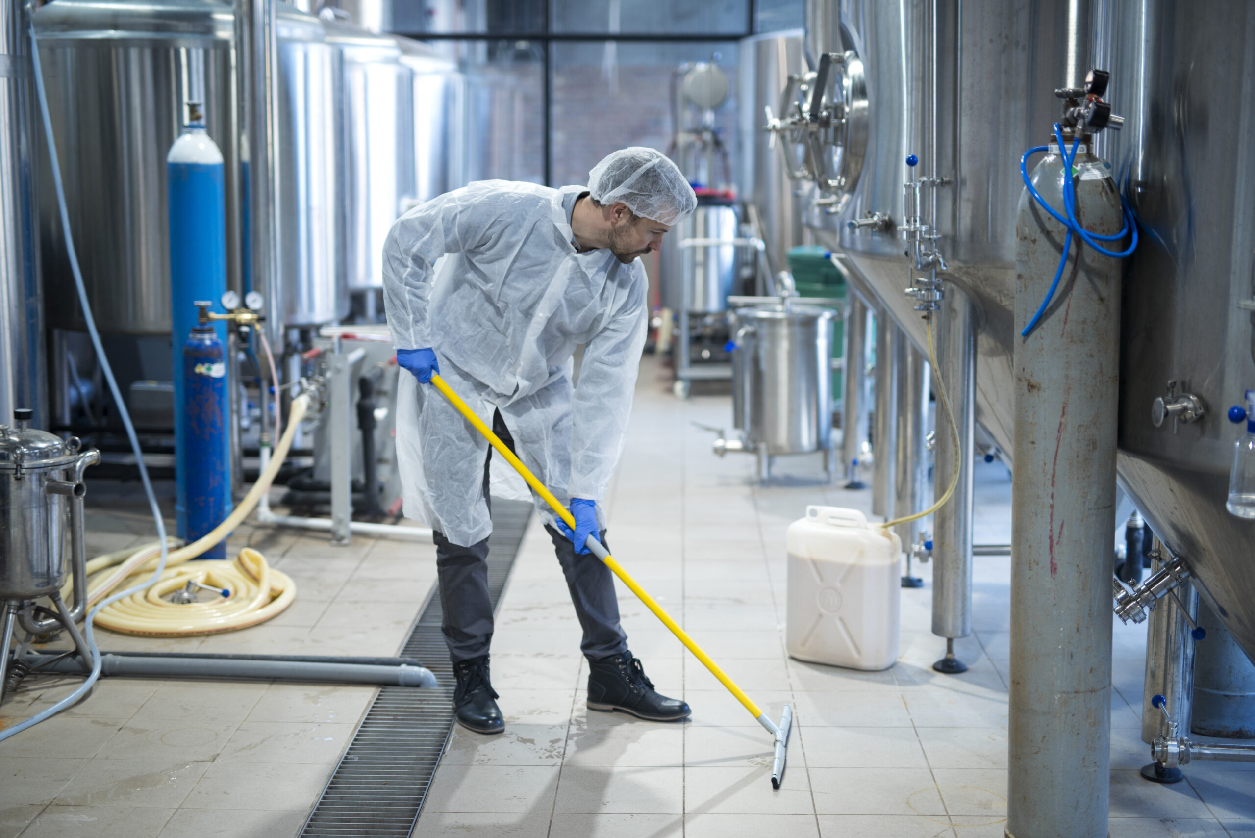 professional industrial cleaner protective uniform cleaning floor food processing plant scaled